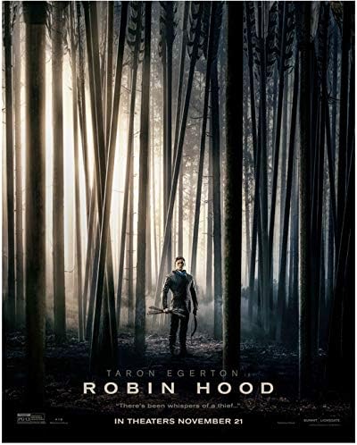 Taron Edgerton kao Robin Hood koji stoji u šumi promotivni video za fotografiju od 8 do 10 inča
